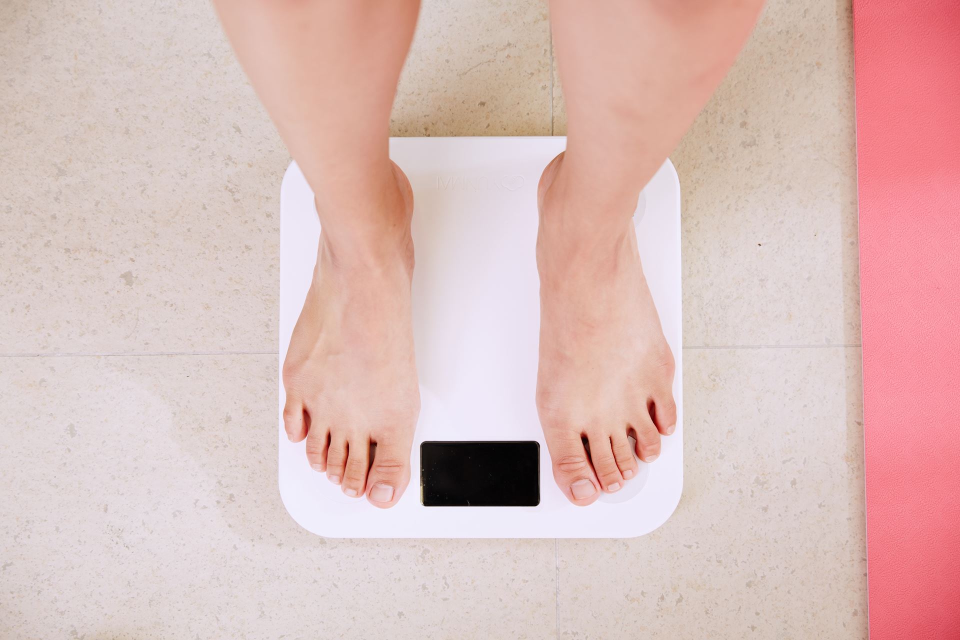 a person weighing themselves